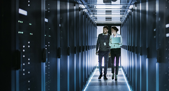 a commercial real estate advisor and property owner walking through a data center
